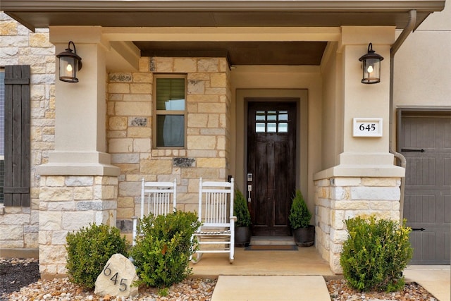 doorway to property featuring stone siding