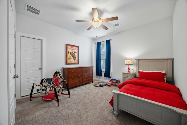 bedroom with carpet floors, visible vents, and a ceiling fan