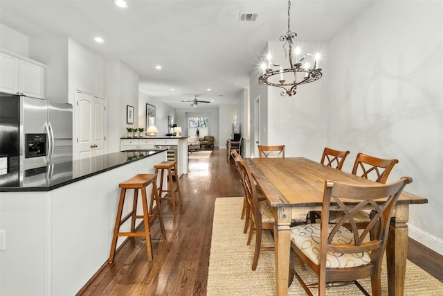 dining area with recessed lighting, visible vents, dark wood finished floors, baseboards, and ceiling fan with notable chandelier