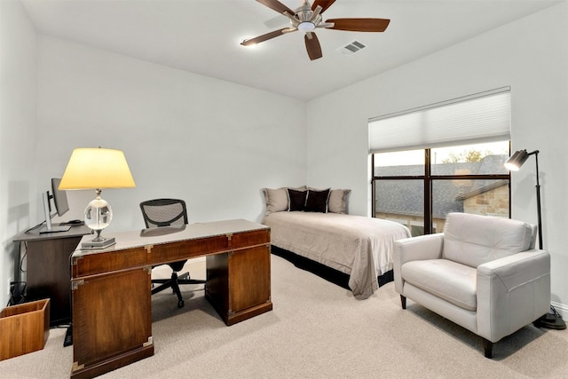 bedroom with light carpet, visible vents, and a ceiling fan