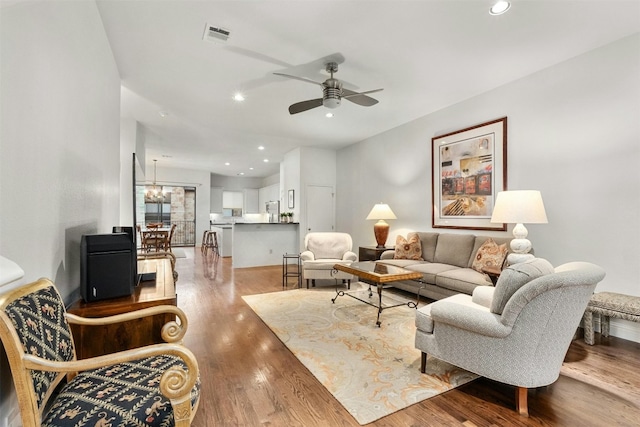 living room with recessed lighting, wood finished floors, visible vents, and ceiling fan