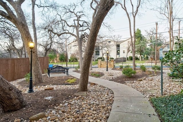 view of community with fence