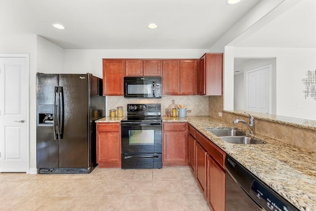 508 Sheldon Lake Dr, Georgetown, TX 78633 - kitchen with black appliances, a sink, light stone countertops, tasteful backsplash, and recessed lighting