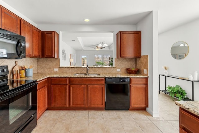 508 Sheldon Lake Dr, Georgetown, TX 78633 - kitchen with black appliances, a sink, decorative backsplash, light stone counters, and light tile patterned flooring