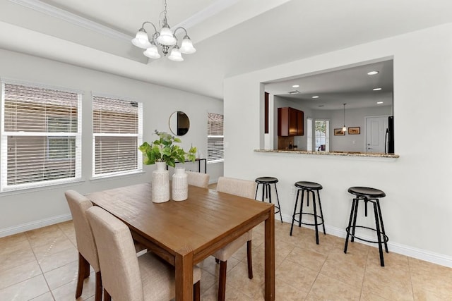 508 Sheldon Lake Dr, Georgetown, TX 78633 - dining room featuring a chandelier, light tile patterned floors, recessed lighting, baseboards, and crown molding