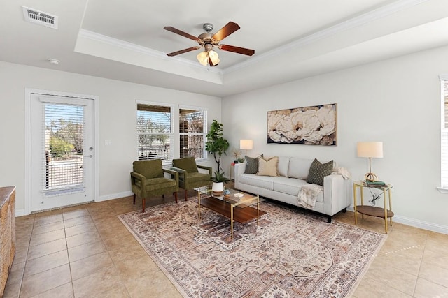 508 Sheldon Lake Dr, Georgetown, TX 78633 - living area with a raised ceiling, light tile patterned floors, ceiling fan, crown molding, and baseboards