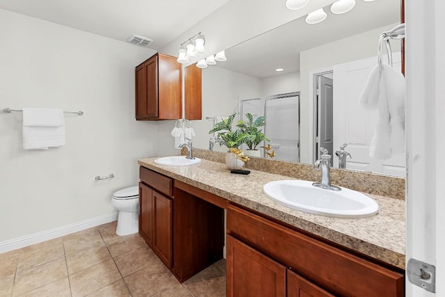 508 Sheldon Lake Dr, Georgetown, TX 78633 - full bath featuring toilet, double vanity, a stall shower, baseboards, and tile patterned floors