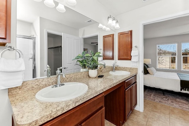 508 Sheldon Lake Dr, Georgetown, TX 78633 - ensuite bathroom with tile patterned flooring, double vanity, and a spacious closet