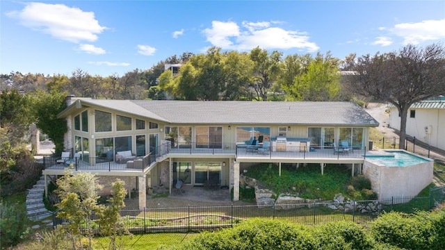 rear view of property with a chimney, a patio area, fence private yard, and a wooden deck