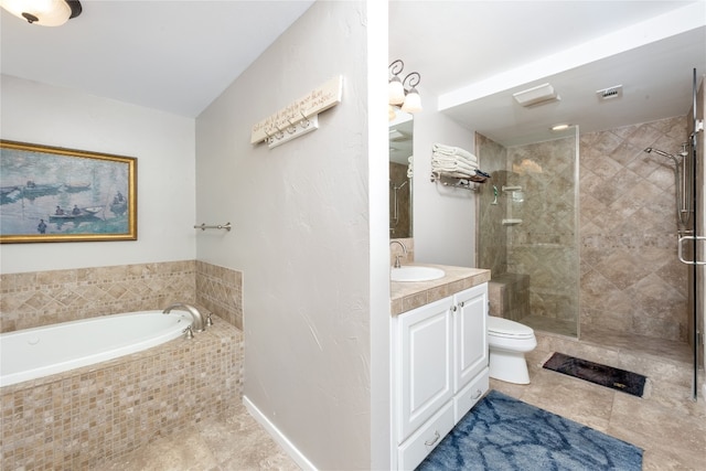 818 Mariner St, Lakeway, TX 78734 - bathroom featuring tile patterned flooring, vanity, toilet, and a garden tub