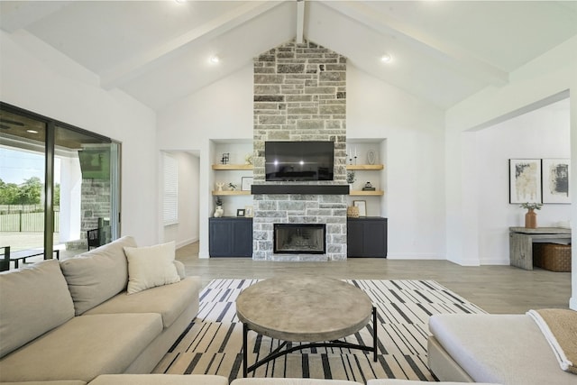 1635 Nature View Loop, Driftwood, TX 78619 - living area featuring a fireplace, high vaulted ceiling, beam ceiling, wood finished floors, and baseboards