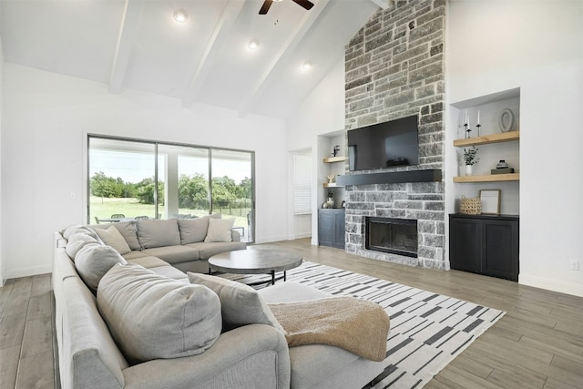 1635 Nature View Loop, Driftwood, TX 78619 - living area featuring ceiling fan, beamed ceiling, high vaulted ceiling, wood finished floors, and baseboards