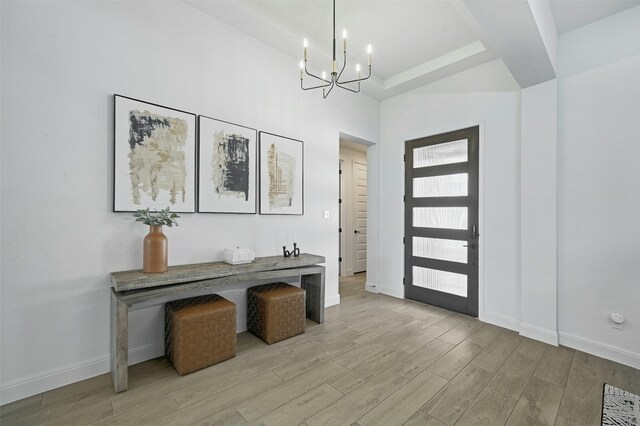 1635 Nature View Loop, Driftwood, TX 78619 - foyer entrance with a chandelier, light wood-style floors, and baseboards
