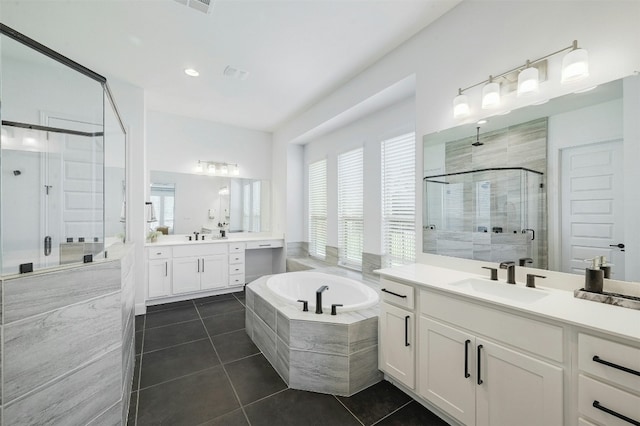 1635 Nature View Loop, Driftwood, TX 78619 - bathroom with a shower stall, tile patterned flooring, two vanities, and plenty of natural light