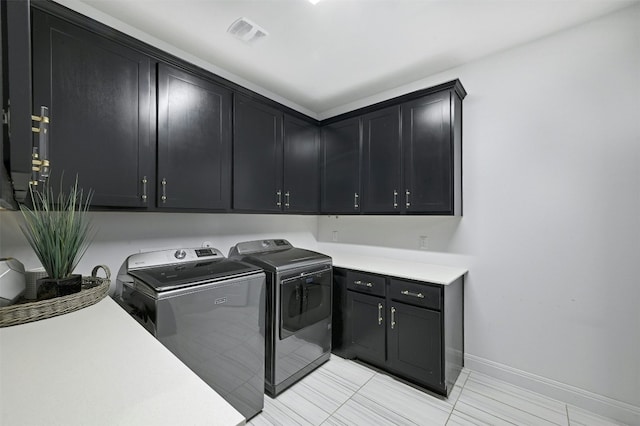 1635 Nature View Loop, Driftwood, TX 78619 - laundry area with cabinet space, washer and dryer, and light tile patterned floors