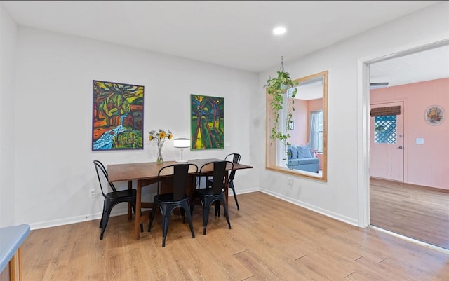 dining room with recessed lighting, light wood-type flooring, and baseboards