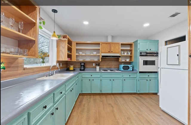 kitchen with open shelves, white appliances, hanging light fixtures, and visible vents