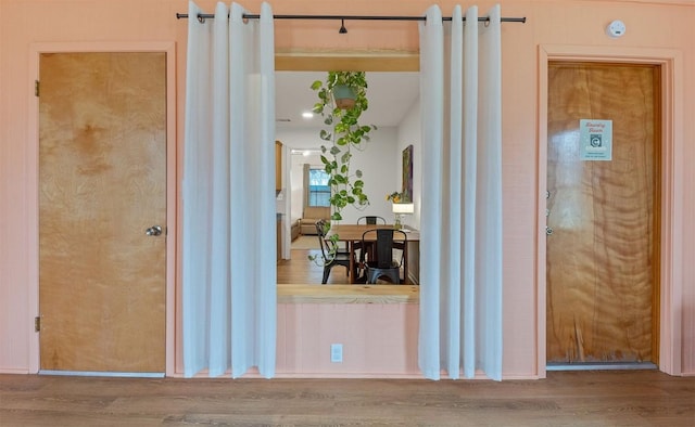 corridor with wood finished floors