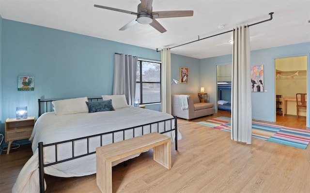 bedroom featuring a ceiling fan and light wood-style flooring