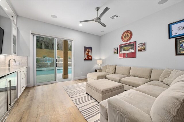 233 Lakefront Dr, Lago Vista, TX 78645 - living room with a ceiling fan, visible vents, light wood finished floors, indoor bar, and recessed lighting