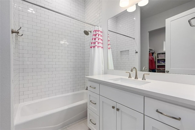 233 Lakefront Dr, Lago Vista, TX 78645 - bathroom with vanity, a spacious closet, and shower / tub combo