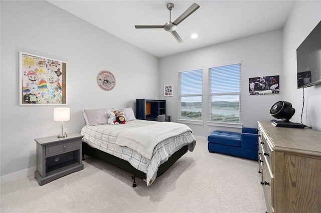 bedroom featuring vaulted ceiling, light carpet, ceiling fan, and baseboards