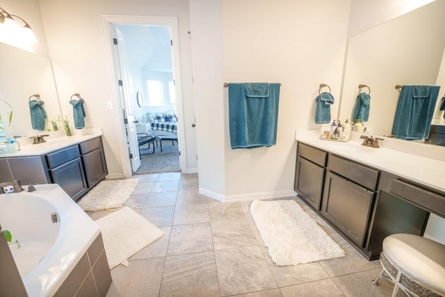 5864 Bianca Dr, Round Rock, TX 78665 - bathroom featuring a bath, vanity, baseboards, and tile patterned floors