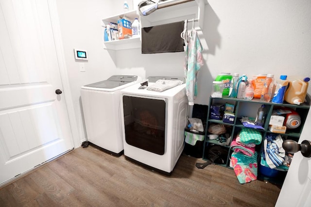 5864 Bianca Dr, Round Rock, TX 78665 - laundry area featuring washing machine and dryer and wood finished floors