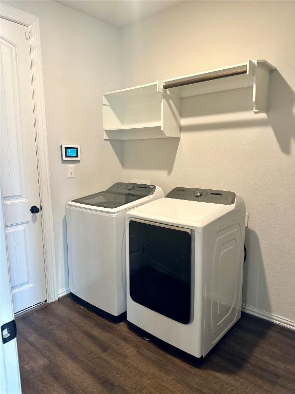 5864 Bianca Dr, Round Rock, TX 78665 - laundry room with washer and clothes dryer and dark wood finished floors