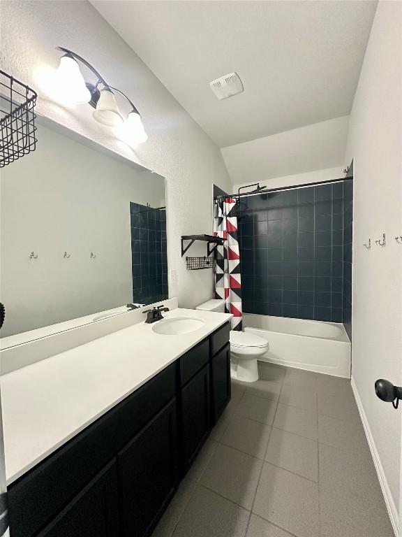 5864 Bianca Dr, Round Rock, TX 78665 - bathroom featuring tile patterned flooring, vanity, shower / bath combo, and lofted ceiling