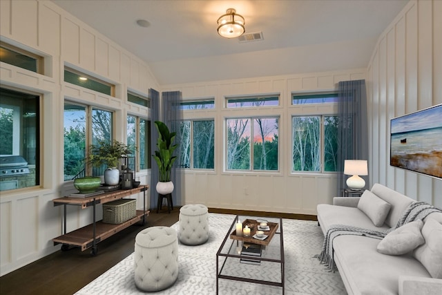 sunroom with lofted ceiling and visible vents