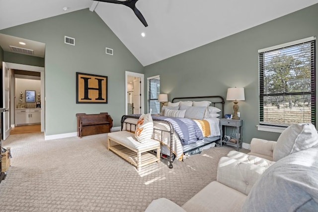 bedroom with high vaulted ceiling, visible vents, light carpet, and baseboards