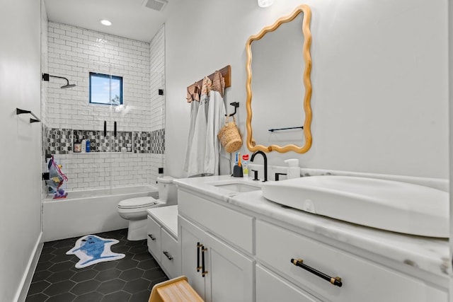 full bathroom with tile patterned flooring, toilet, a sink, double vanity, and washtub / shower combination