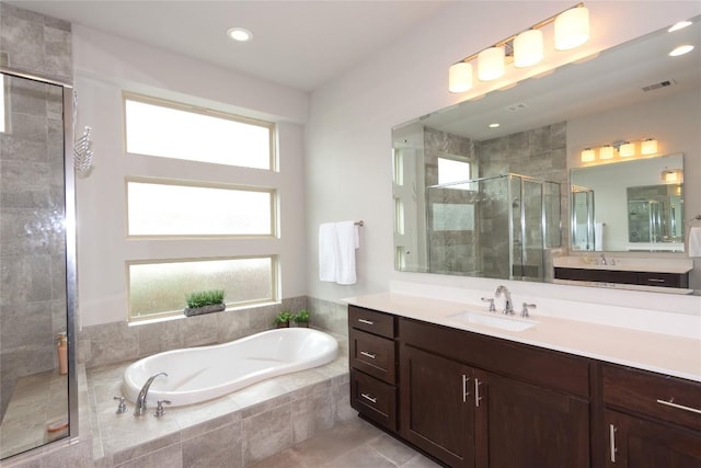 2617 Long Lasso Pass, Leander, TX 78641 - bathroom featuring a stall shower, a garden tub, vanity, and recessed lighting