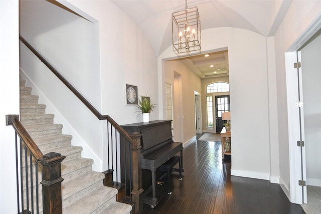 2617 Long Lasso Pass, Leander, TX 78641 - entrance foyer featuring stairway, a chandelier, dark wood-style floors, baseboards, and lofted ceiling