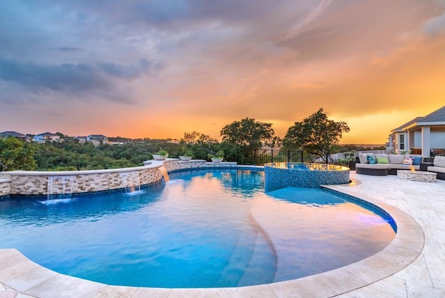 view of pool featuring an outdoor hangout area, a patio, fence, and a pool with connected hot tub