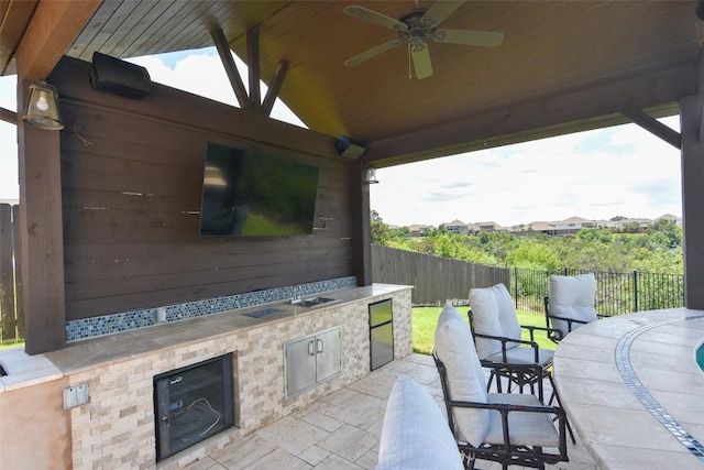 2617 Long Lasso Pass, Leander, TX 78641 - view of patio / terrace with an outdoor kitchen and a ceiling fan