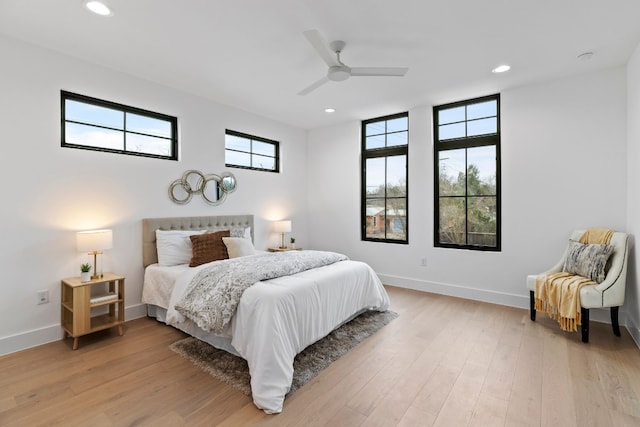 bedroom with a ceiling fan, recessed lighting, baseboards, and light wood finished floors