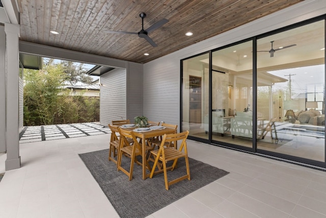 view of patio with outdoor dining area and ceiling fan