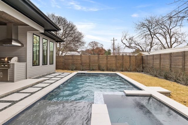 view of swimming pool featuring area for grilling, a fenced backyard, and a pool with connected hot tub