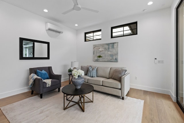 living room with light wood-style floors, recessed lighting, baseboards, and a wall mounted AC