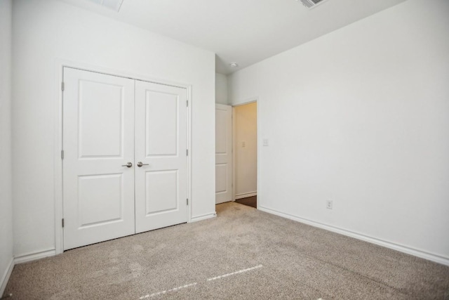 1011 Moose Rd, Hutto, TX 78634 - unfurnished bedroom featuring carpet floors, a closet, and baseboards