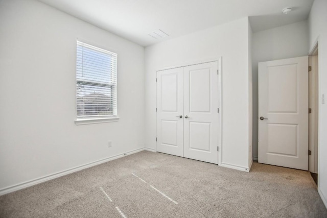 1011 Moose Rd, Hutto, TX 78634 - unfurnished bedroom with carpet floors, a closet, and baseboards