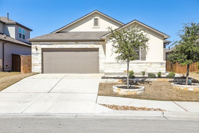 1011 Moose Rd, Hutto, TX 78634 - view of front of property featuring stone siding, a garage, concrete driveway, and stucco siding