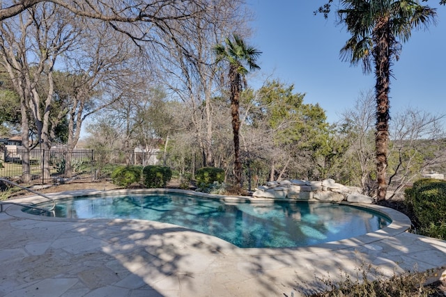 view of pool featuring a patio area, fence, and a fenced in pool