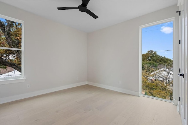 1135 Salina St, Austin, TX 78702 - spare room with light wood-style flooring and ceiling fan