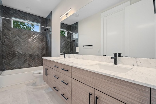 1135 Salina St, Austin, TX 78702 - full bathroom featuring double vanity, toilet, shower / bathtub combination, and marble finish flooring