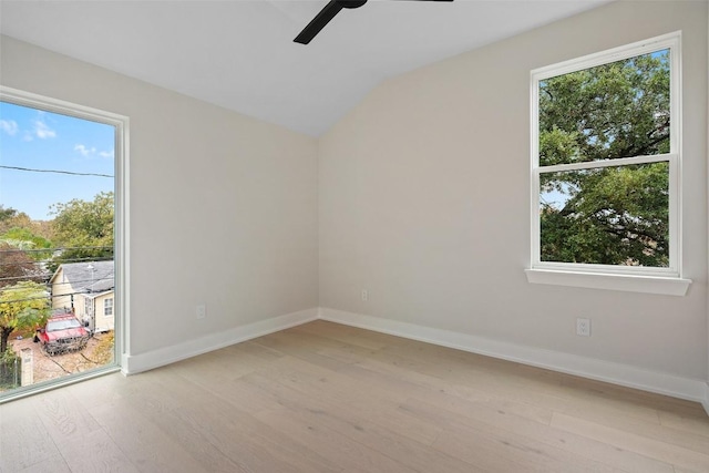 1135 Salina St, Austin, TX 78702 - unfurnished room with ceiling fan, light wood finished floors, lofted ceiling, and healthy amount of natural light