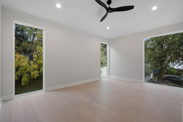 1135 Salina St, Austin, TX 78702 - spare room featuring wood finished floors, a ceiling fan, recessed lighting, and baseboards