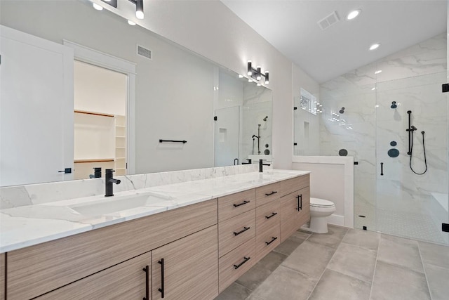 1135 Salina St, Austin, TX 78702 - full bath with a marble finish shower, double vanity, toilet, and recessed lighting